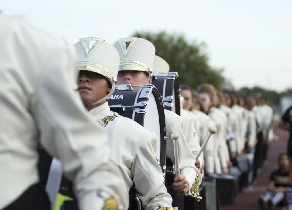 types of booster clubs marching band in white uniforms