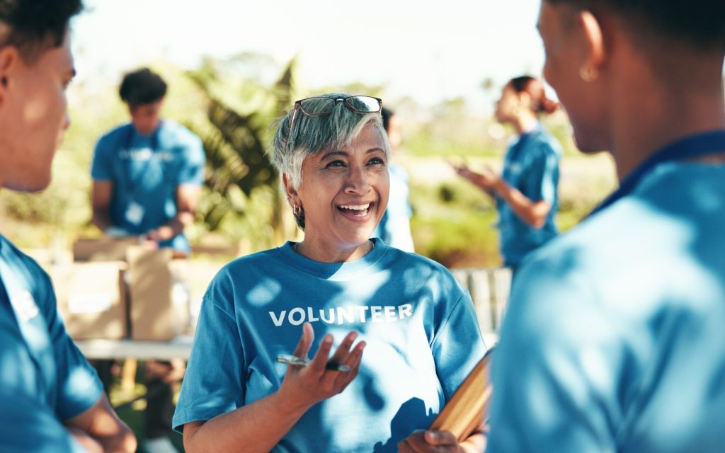 Nonprofit vs. not-for-profit vs. 510(c)(3) Volunteers chat on a sunny day